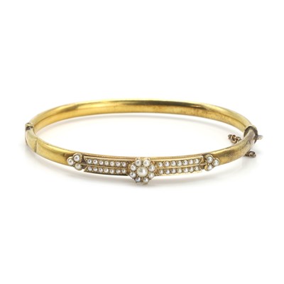 Lot 23 - A late Victorian split pearl set bangle