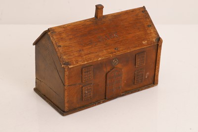 Lot 327 - A folk art elm money box
