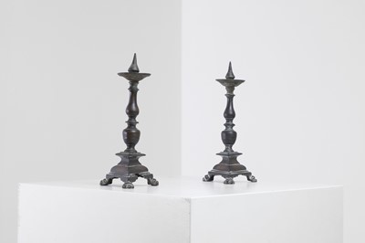 Lot 510 - A pair of bronze pricket candlesticks
