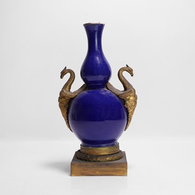 Lot 365 - A Chinese blue-glazed double gourd vase