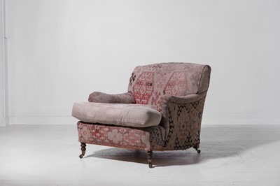 Lot 104 - A kilim-upholstered armchair by George Smith