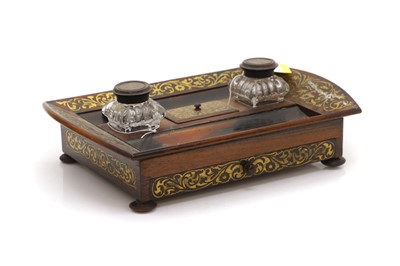 Lot 160 - A Regency rosewood desk stand with brass inlay