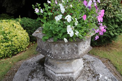 Lot 552 - A modern composite stone octagonal font