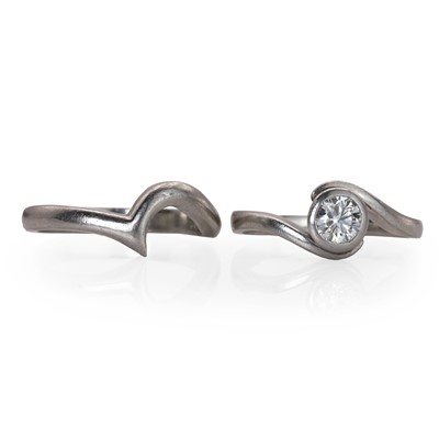 Lot 1079 - A platinum diamond single stone ring and a platinum fitted band ring
