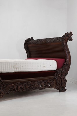 Lot 497 - A large export carved hardwood double bed