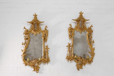 Lot 15 - A pair of George III-style carved giltwood girandoles in the Chippendale taste