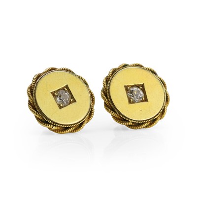 Lot 1034 - A pair of diamond stud earrings