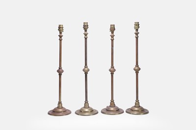 Lot 332 - A set of four brass table lamps