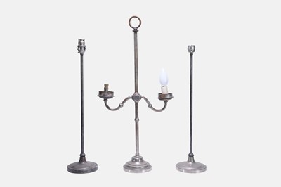 Lot 334 - A set of three white-metal table lamps