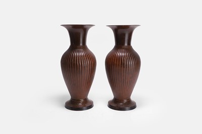 Lot 21 - A pair of patinated metal urns