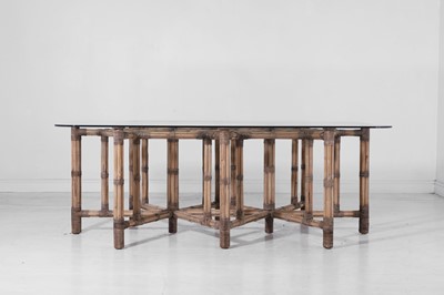 Lot 521 - A bamboo and glass dining table