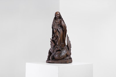 Lot 119 - A carved oak figure of Saint Margaret of Antioch