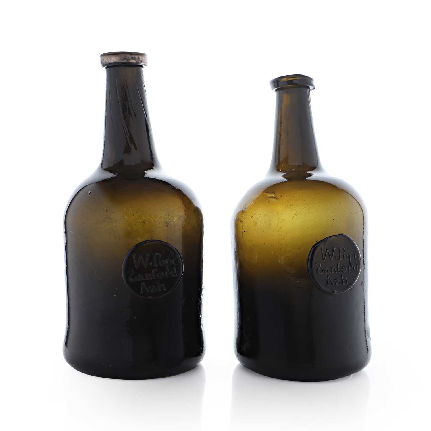 Lot 20 - A near pair of olive-green glass wine bottles