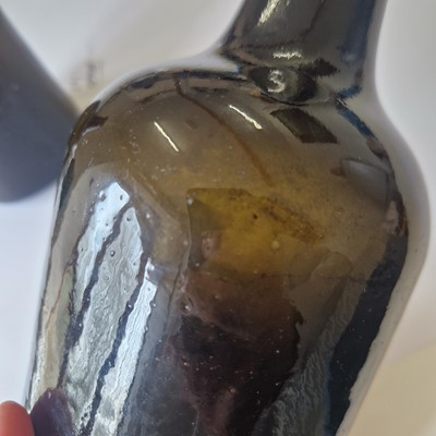 Lot 20 - A near pair of olive-green glass wine bottles
