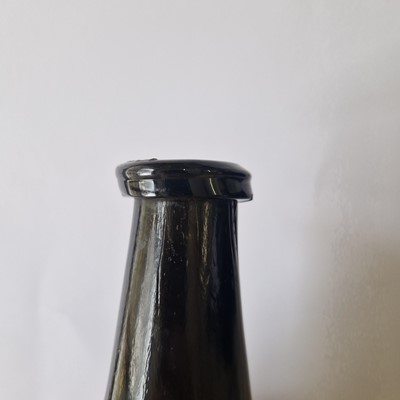 Lot 20 - A near pair of olive-green glass wine bottles
