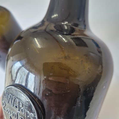 Lot 20 - A near pair of olive-green glass wine bottles