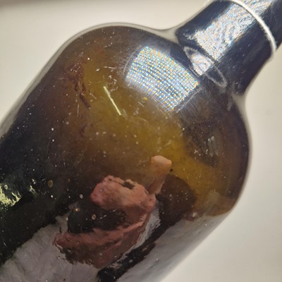 Lot 20 - A near pair of olive-green glass wine bottles