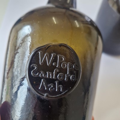 Lot 20 - A near pair of olive-green glass wine bottles