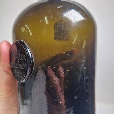 Lot 20 - A near pair of olive-green glass wine bottles