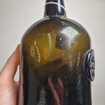 Lot 20 - A near pair of olive-green glass wine bottles