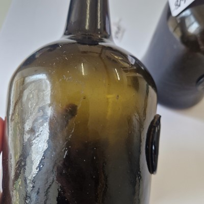 Lot 20 - A near pair of olive-green glass wine bottles