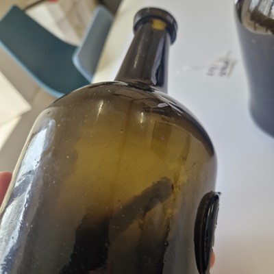 Lot 20 - A near pair of olive-green glass wine bottles