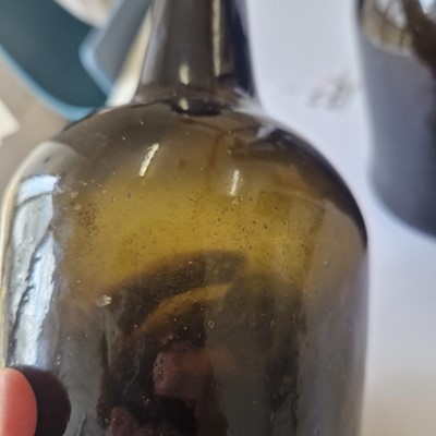 Lot 20 - A near pair of olive-green glass wine bottles