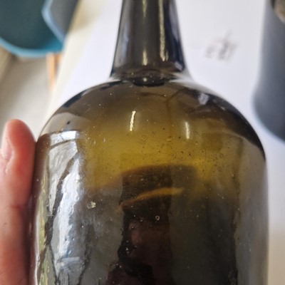 Lot 20 - A near pair of olive-green glass wine bottles