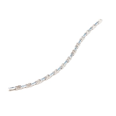 Lot 1181 - A 9ct white gold aquamarine and diamond line bracelet