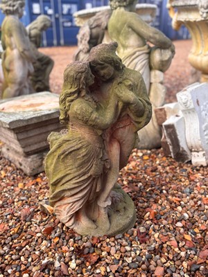 Lot 553 - A reconstituted garden figure of lovers