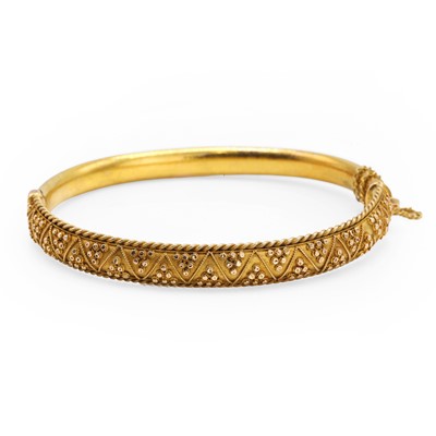 Lot 1005 - A Victorian Etruscan revival hinged bangle