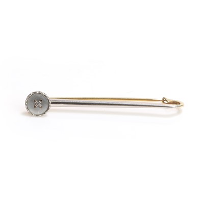 Lot 1033 - An early 20th century mother of pearl button brooch