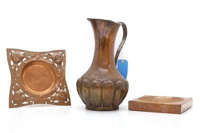 Lot 317 - An Arts and Crafts copper jug and two dishes