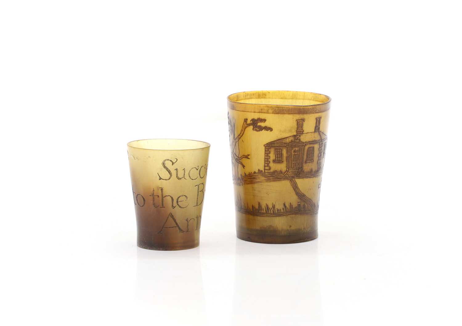Lot 302 - Two miniature horn beakers