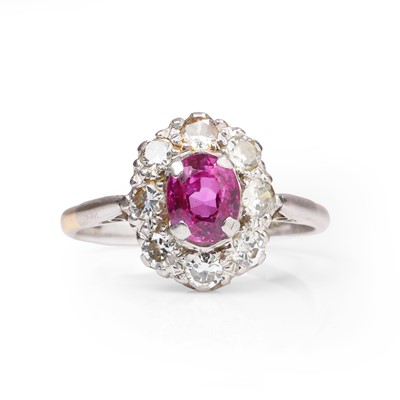 Lot 1054 - A pink sapphire and diamond cluster ring