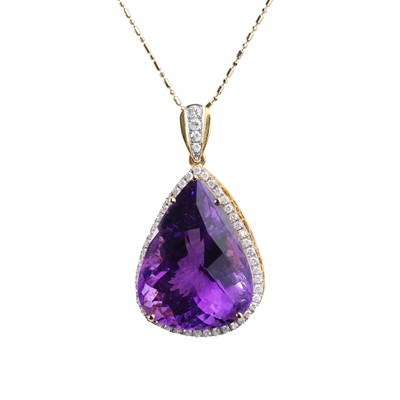 Lot 110 - An amethyst and diamond pendant on chain
