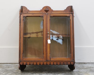 Lot 536 - A Gothic Revival walnut glazed hanging bookcase