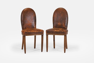 Lot 85 - A pair of studded leather and beech side chairs