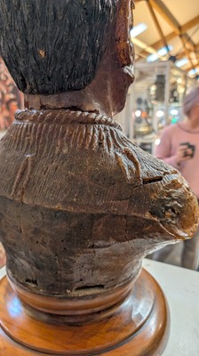 Lot 118 - A large carved kauri gum bust of Maori Chief Tamati Tamaiwhakanehua
