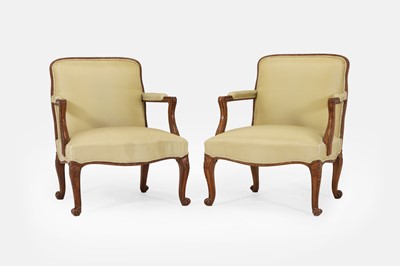 Lot 386 - A pair of carved mahogany open armchairs in the George III style