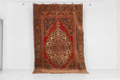 Lot 407 - A tribal wool carpet
