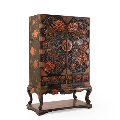 Lot 120 - A carved lacquered cabinet