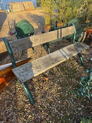Lot 551 - A cast iron and wood bench