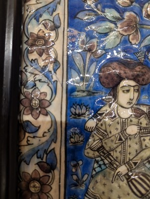 Lot 15 - A large Qajar moulded and underglaze-painted pottery figural tile