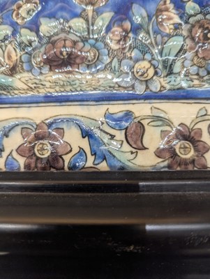 Lot 15 - A large Qajar moulded and underglaze-painted pottery figural tile