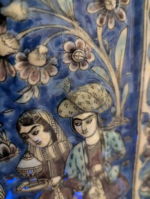 Lot 15 - A large Qajar moulded and underglaze-painted pottery figural tile