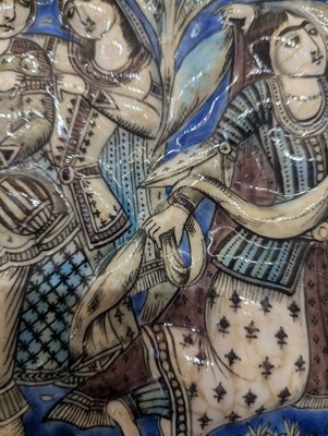 Lot 15 - A large Qajar moulded and underglaze-painted pottery figural tile