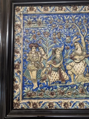 Lot 15 - A large Qajar moulded and underglaze-painted pottery figural tile