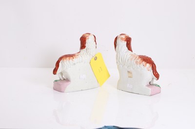 Lot 114 - A pair of Staffordshire pottery spaniels