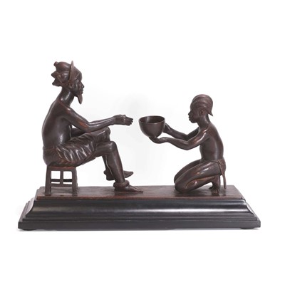 Lot 105 - A carved figural group